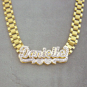 Close-up front view of a 3D hand-engraved 10K yellow gold iced out name necklace