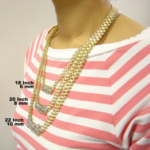 Model wearing 10K gold custom nameplate necklace paired with longer gold chains
