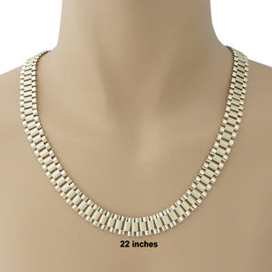 Model wearing 10K solid gold 12mm presidential link chain necklace