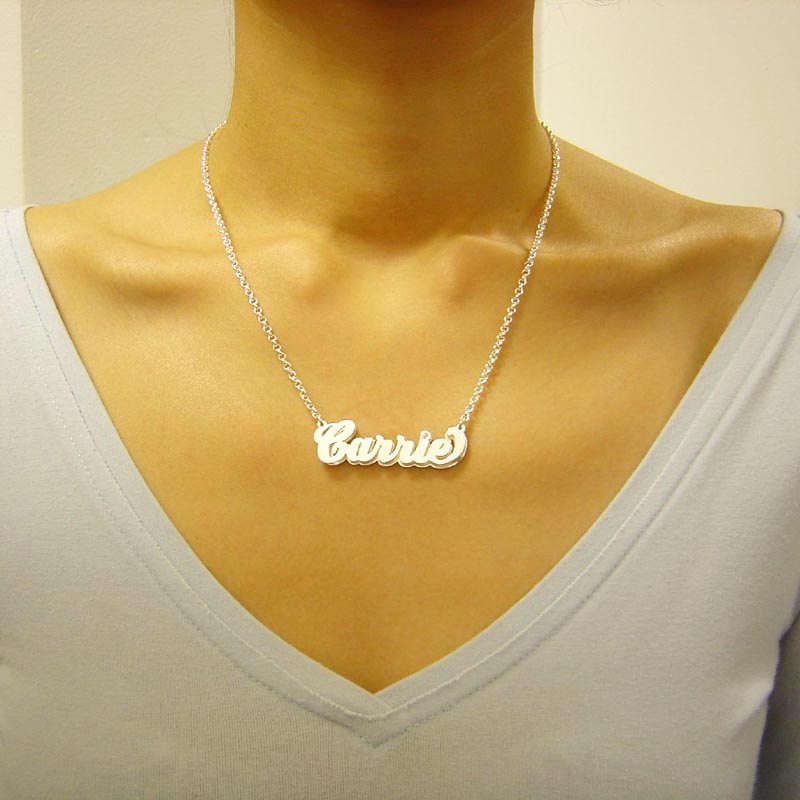 Model wearing custom sterling silver 3D name necklace on a 16-inch 2.5mm Rolo chain