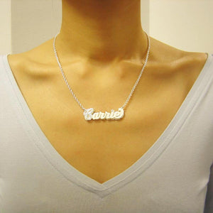 Model wearing a personalized 3D sterling silver double nameplate necklace with diamond accents on a chain.