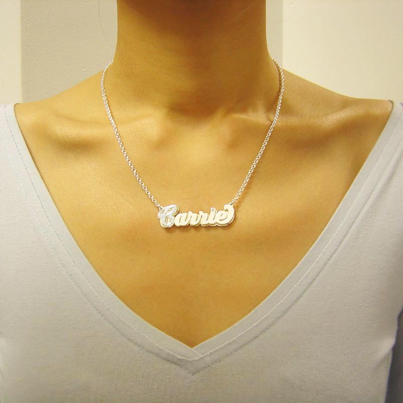 Model wearing a personalized 3D sterling silver double nameplate necklace with diamond accents on a chain.