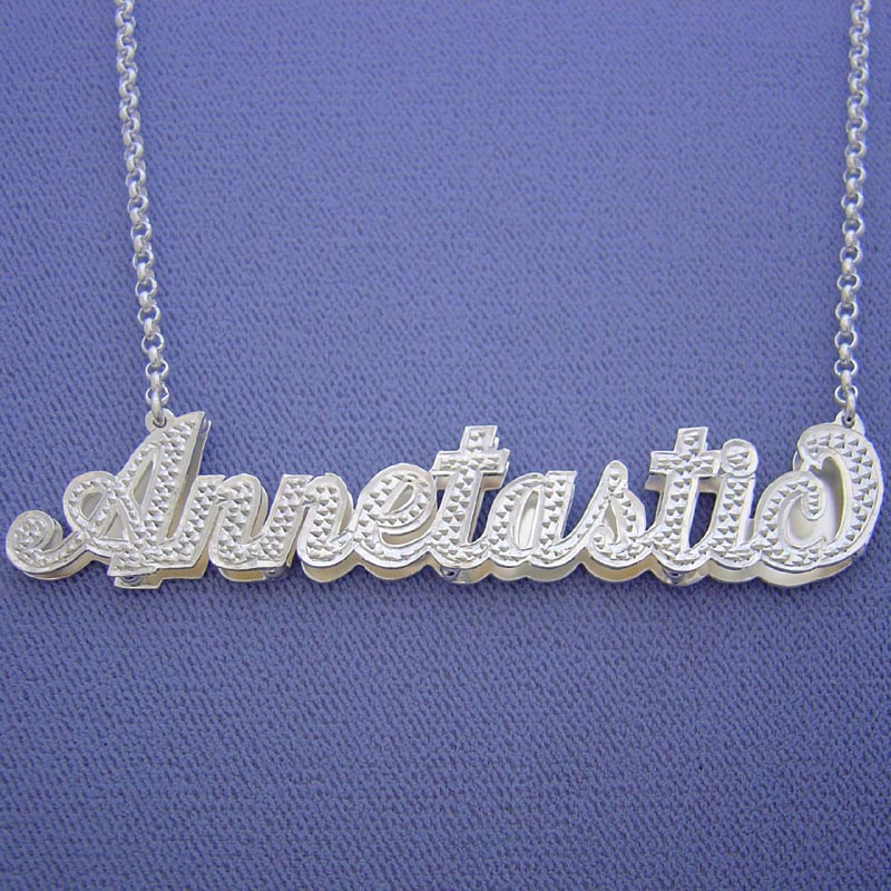 Large 3-inch custom 3D name necklace in sterling silver featuring double-plated cursive nameplate "Annetastia" with diamond accents.