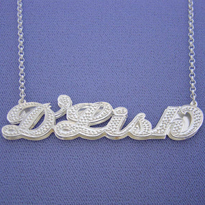 Custom sterling silver 3D double name plate pendant featuring diamond accents on the name "D'Lish" attached to a fine chain.