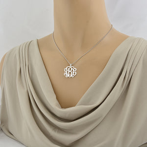 Model wearing custom 1-inch sterling silver 3-initial monogram pendant necklace