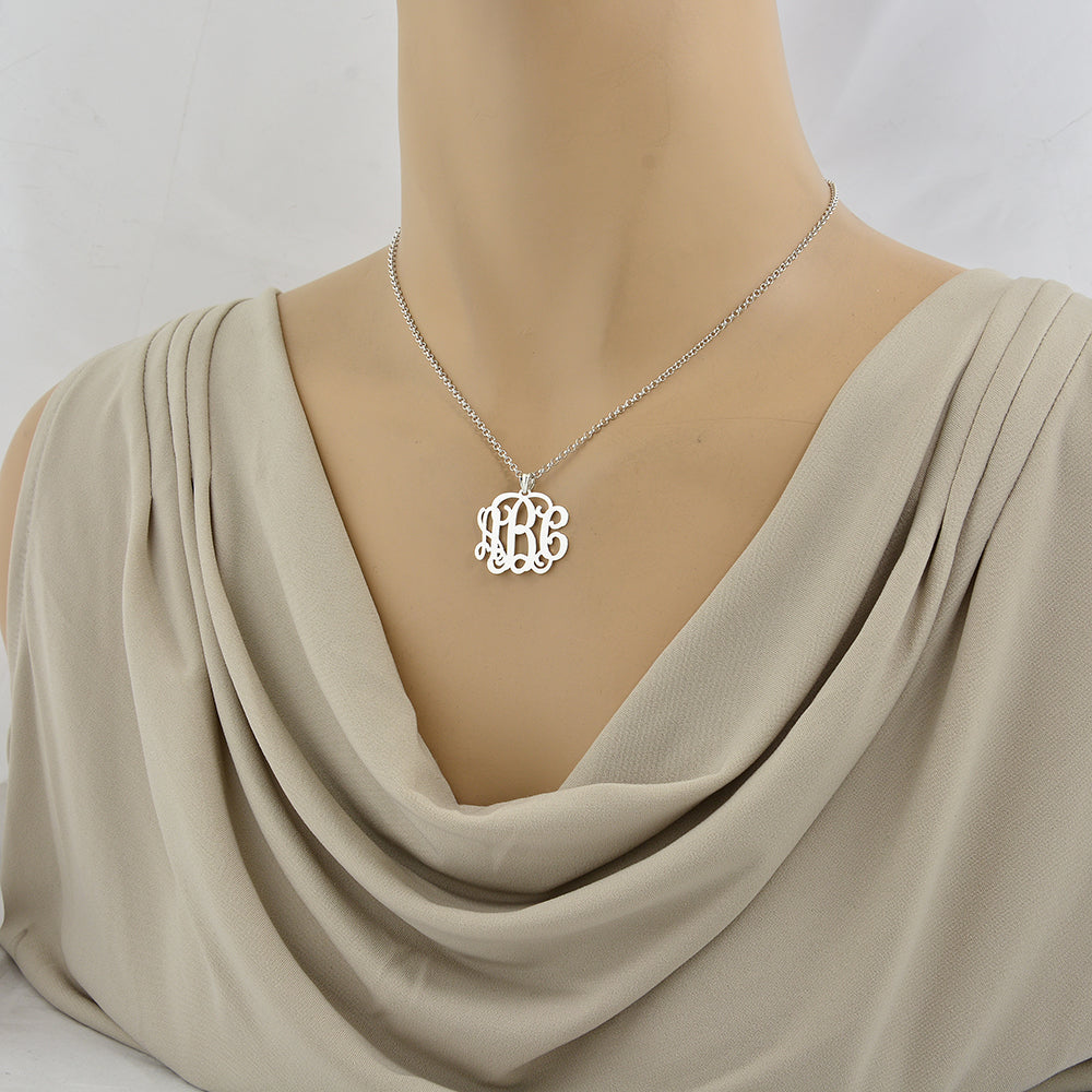 Model wearing custom 1-inch sterling silver 3-initial monogram pendant necklace