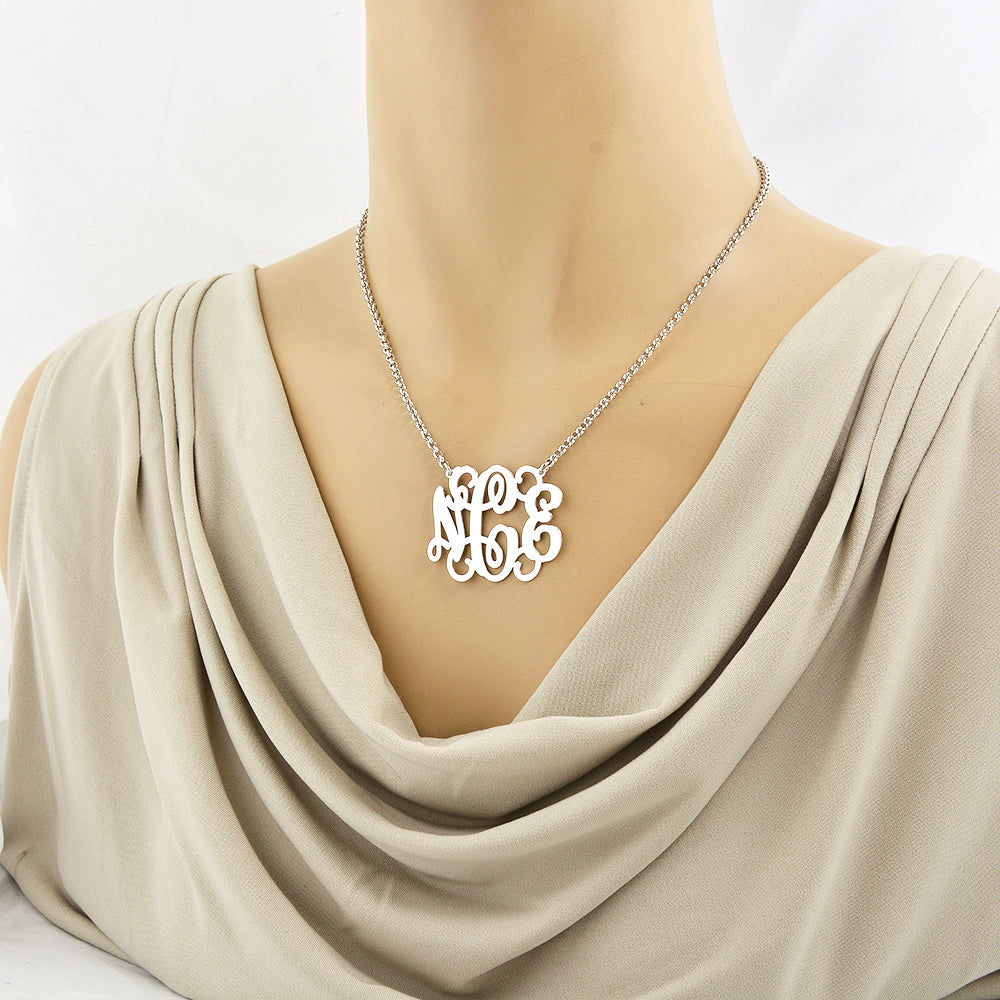 Model wearing 1.5-inch personalized sterling silver 3-initial monogram necklace