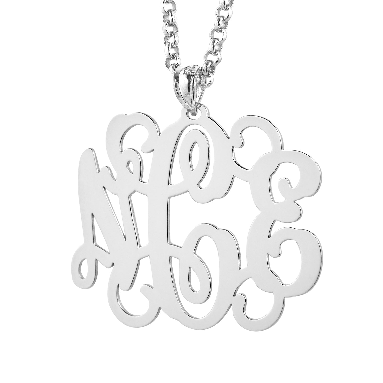 Close-up detail of polished laser-cut sterling silver monogram pendant