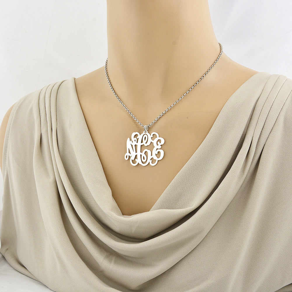 Model wearing personalized sterling silver 3-initial monogram pendant necklace