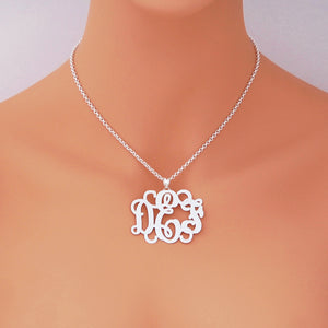 Model wearing the personalized 1.75-inch sterling silver 3-initial monogram necklace on a silver chain.