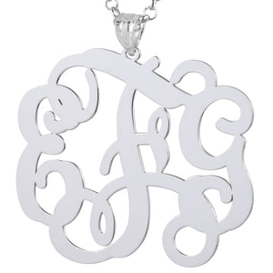 Detailed view of a custom laser-cut sterling silver 3-initial monogram pendant