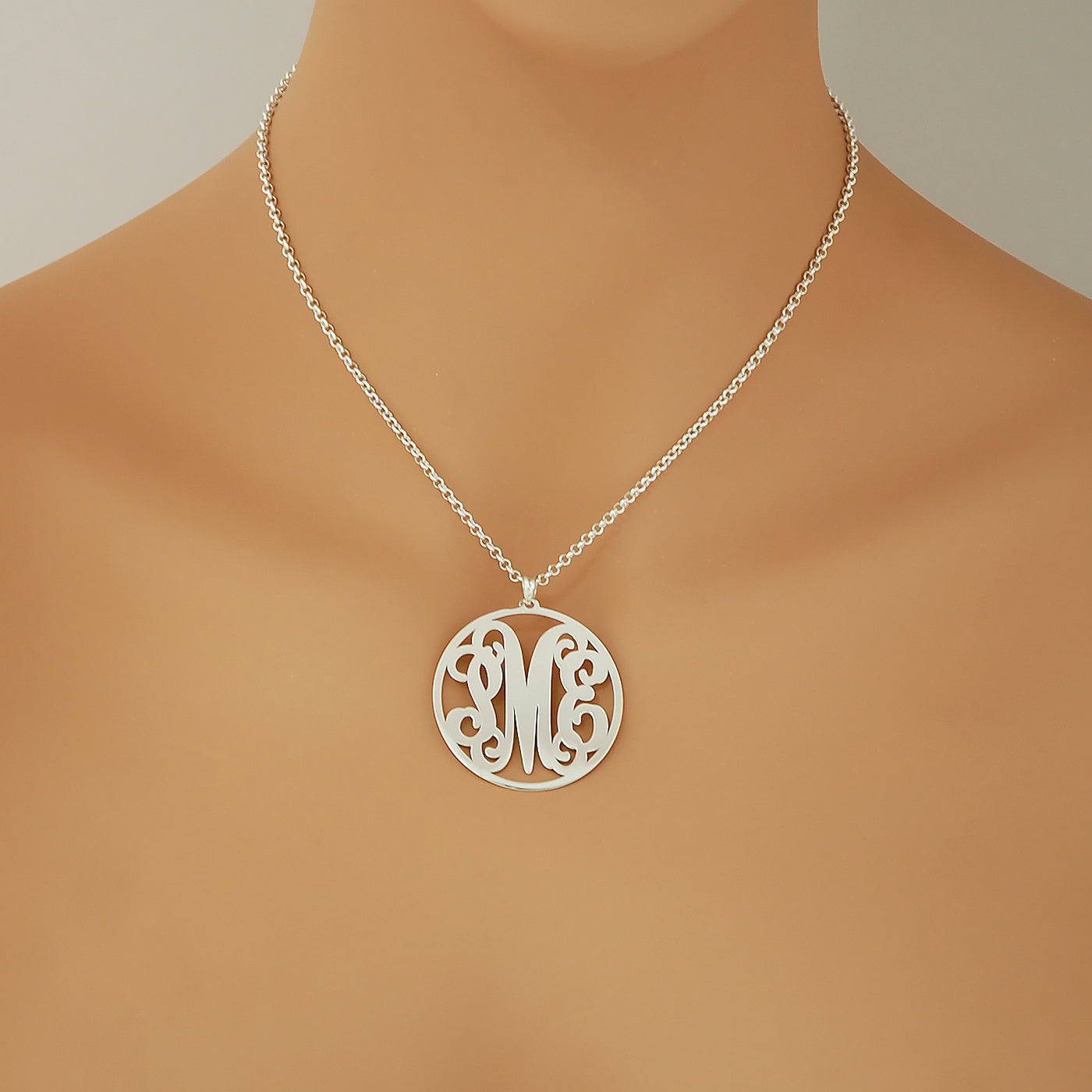 Model wearing personalized 3-initial sterling silver circle monogram pendant necklace.