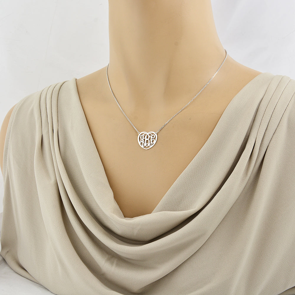 Woman wearing the personalized 3/4-inch sterling silver heart monogram necklace