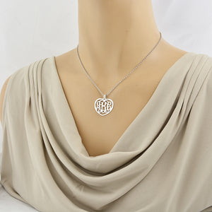Model wearing the 1-inch custom sterling silver heart monogram necklace.