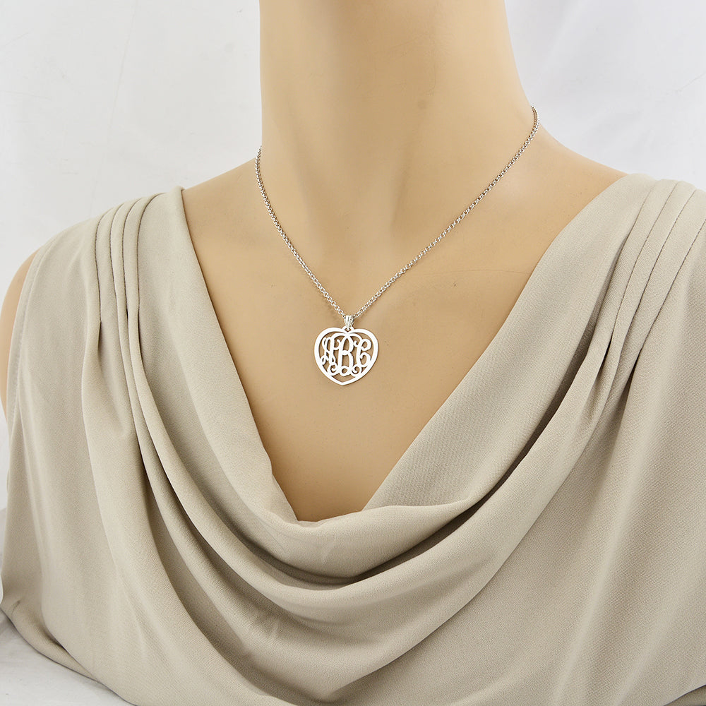 Model wearing the 1-inch custom sterling silver heart monogram necklace.