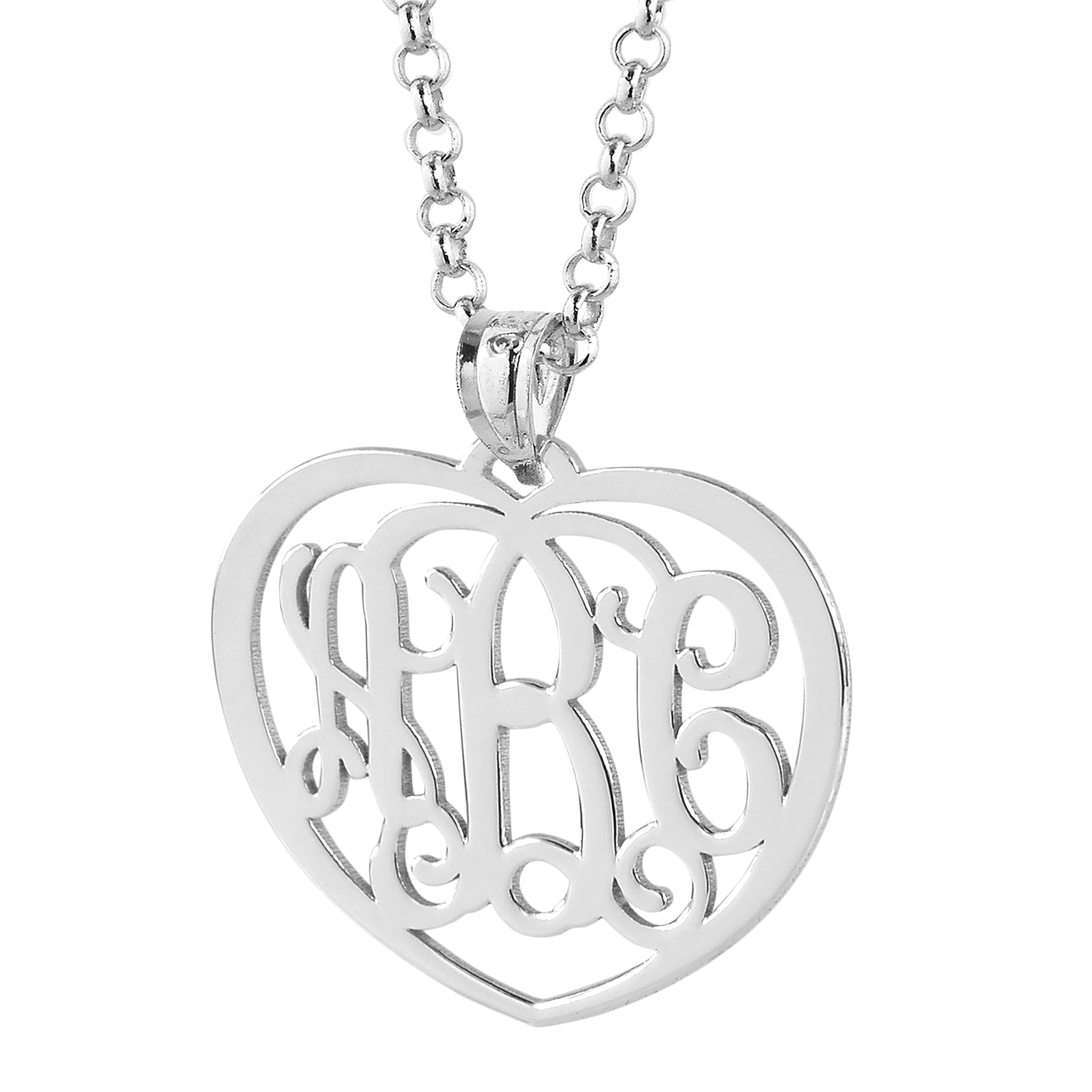 Close-up view of the polished sterling silver heart-shaped monogram pendant on a silver chain link.