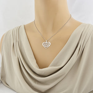 Woman wearing the custom 1-inch sterling silver heart monogram necklace