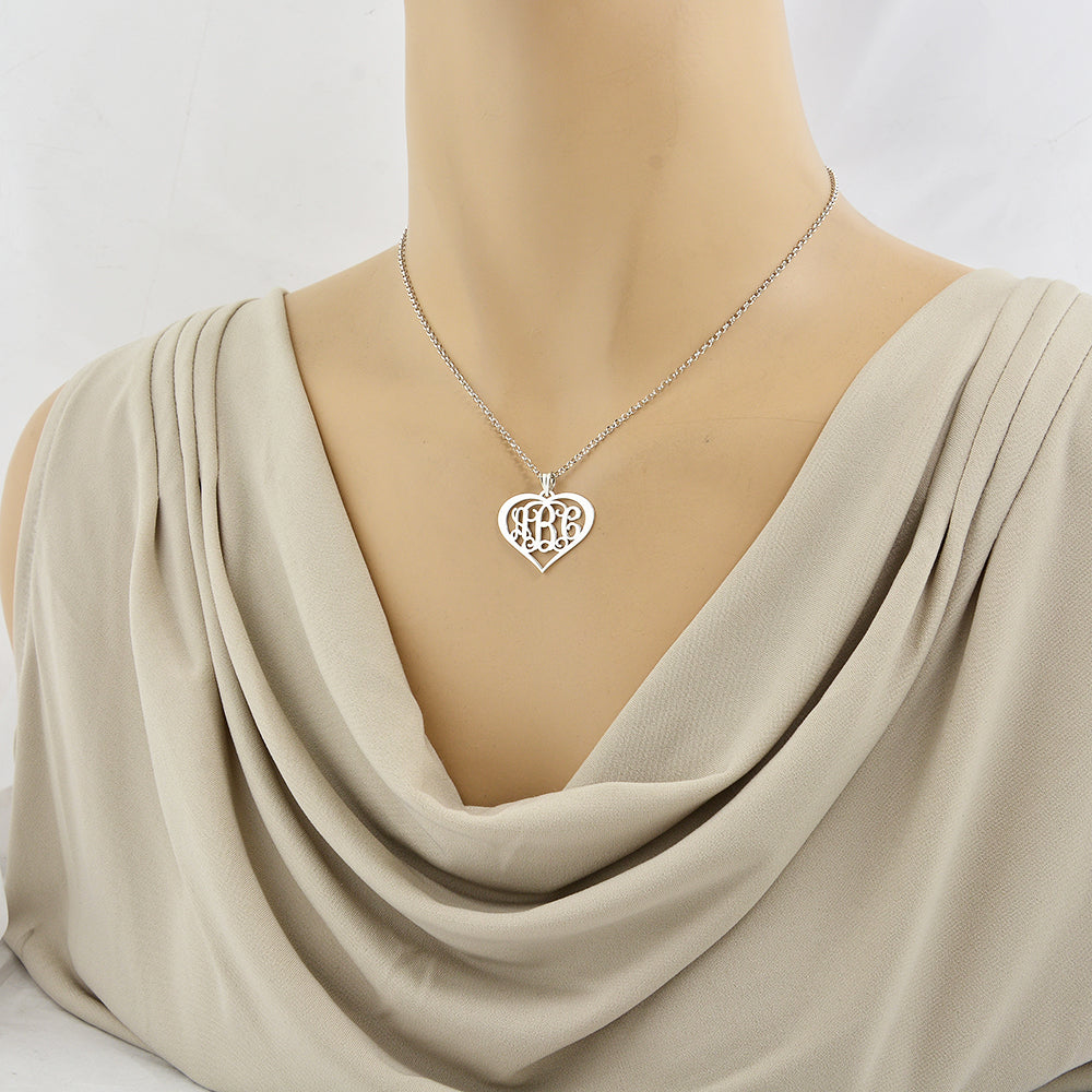 Woman wearing the custom 1-inch sterling silver heart monogram necklace