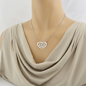 Model wearing a personalized sterling silver 3-initial heart monogram necklace.