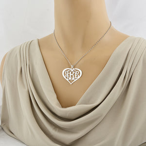 Model wearing a personalized sterling silver 3-initial heart monogram necklace