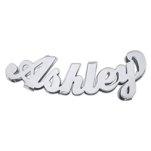 Large 3D sterling silver curved nameplate pendant spelling "Ashley" in bold cursive script with a high-shine polished finish.