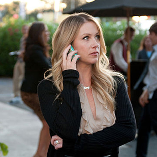 Christina Applegate on set wearing the handcrafted 14k gold Amy nameplate necklace from NBC's Up All Night.