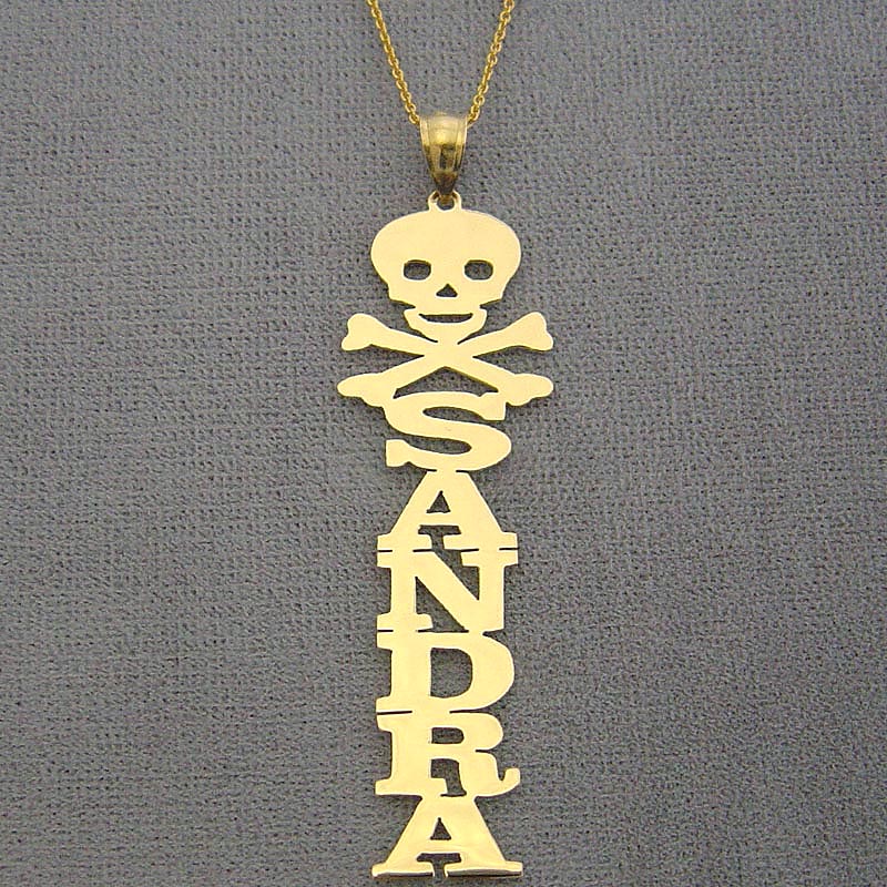 Solid 10k yellow gold vertical nameplate necklace featuring custom name Kassandra topped with an edgy laser-cut skull emblem