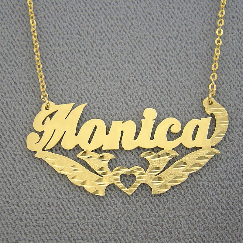 Custom 14k yellow gold diamond-cut nameplate necklace featuring the name Monica with heart accent and underline detail.