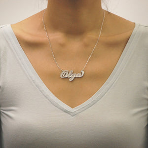 Model wearing a handcrafted custom 3D gold diamond nameplate necklace featuring a double-layer design.