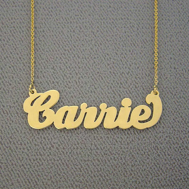 Close-up view of a handcrafted custom Carrie script name pendant.
