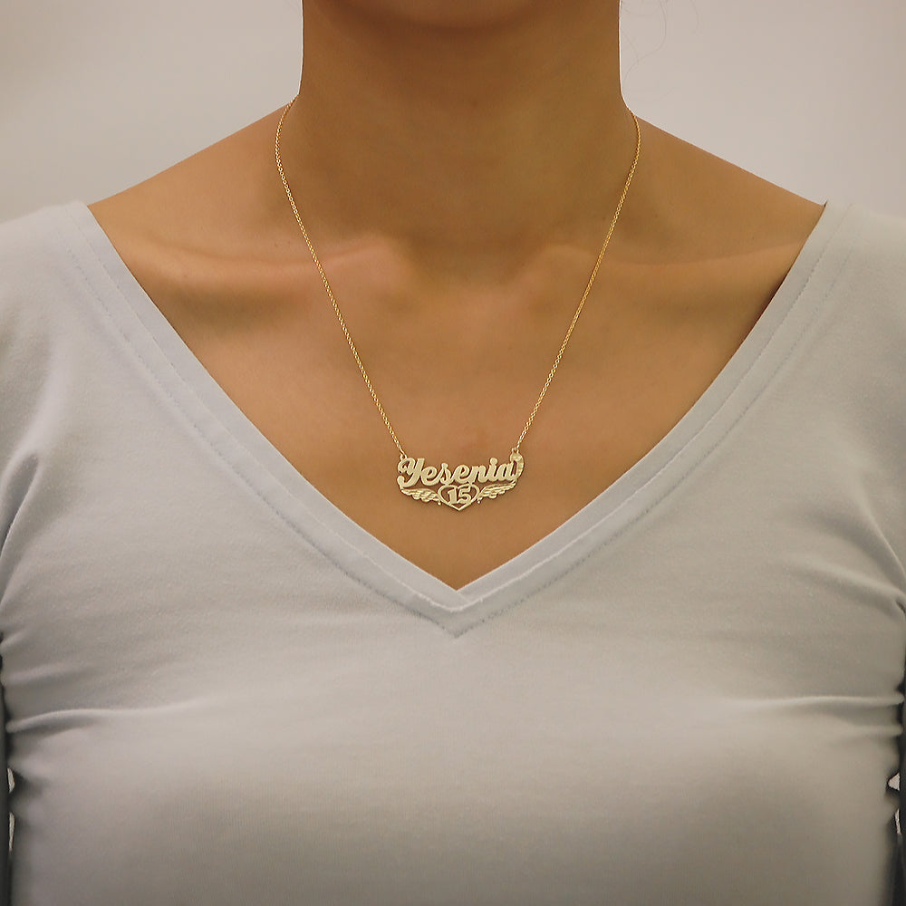 Close-up view of a custom gold Quinceañera name pendant attached to a 1.0mm Rollo chain.