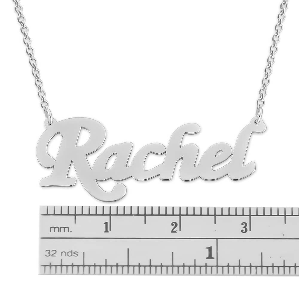 Close-up view of a custom sterling silver script nameplate pendant showing fine craftsmanship and metal finish.