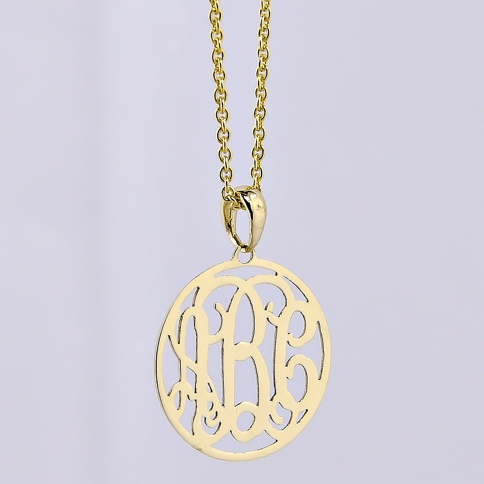Extra-small solid gold 3-initial circle monogram pendant necklace on a light gray background.