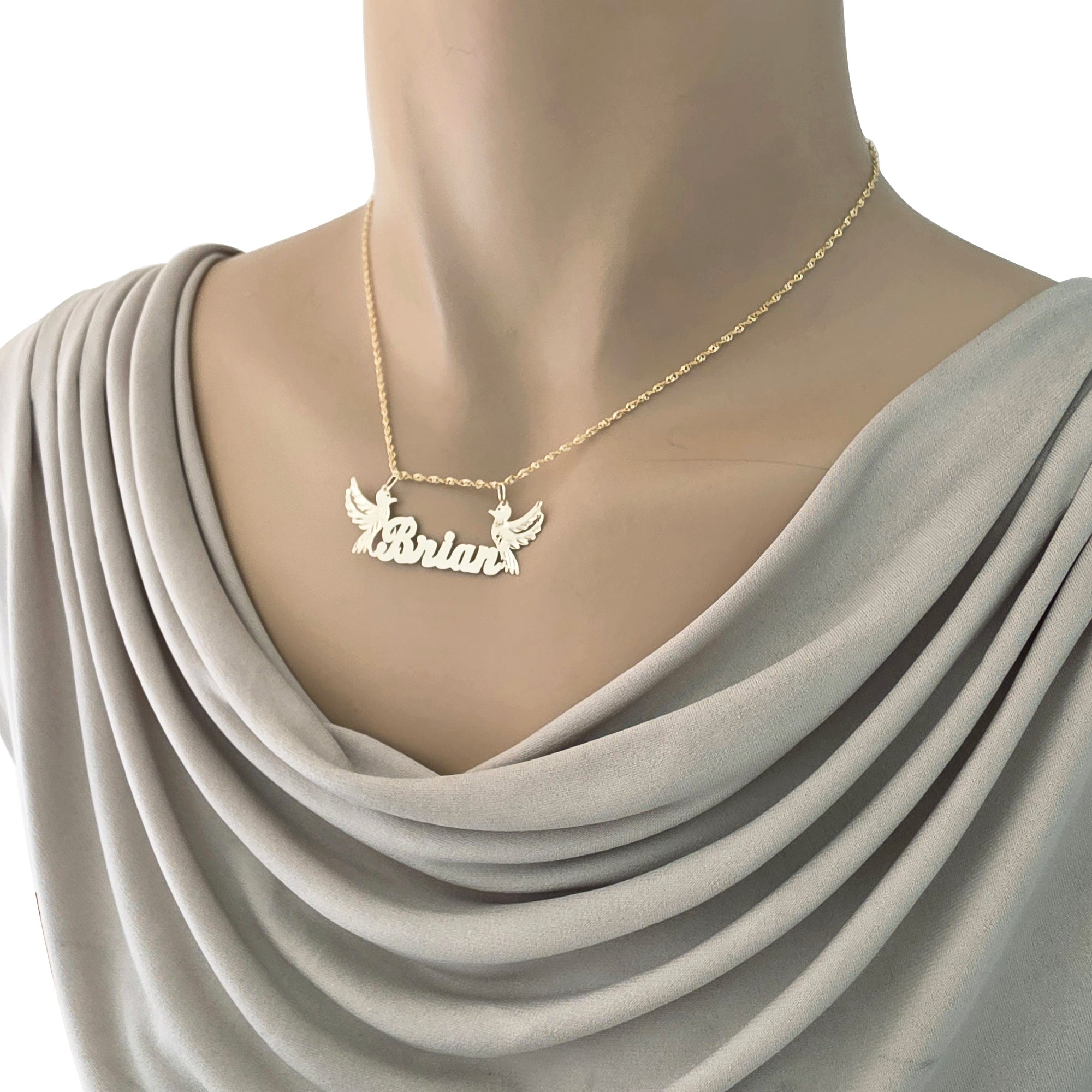 Gold nameplate necklace featuring Brian pendant on a mannequin.