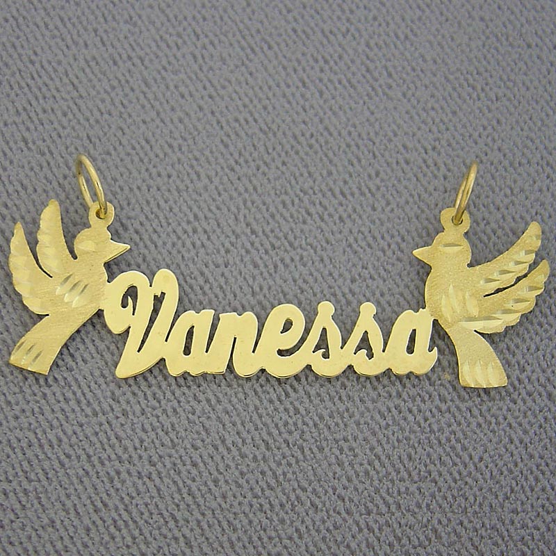 Close-up view of the diamond-cut dove accent on custom gold nameplate.