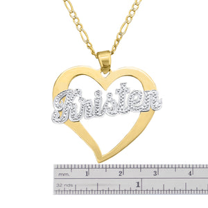 Close-up view of custom gold script name inside a yellow gold heart frame