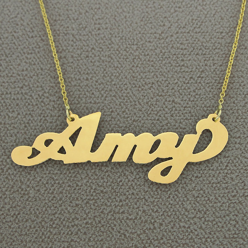 Close-up view of the custom handcrafted 10k yellow gold Amy script nameplate necklace pendant.