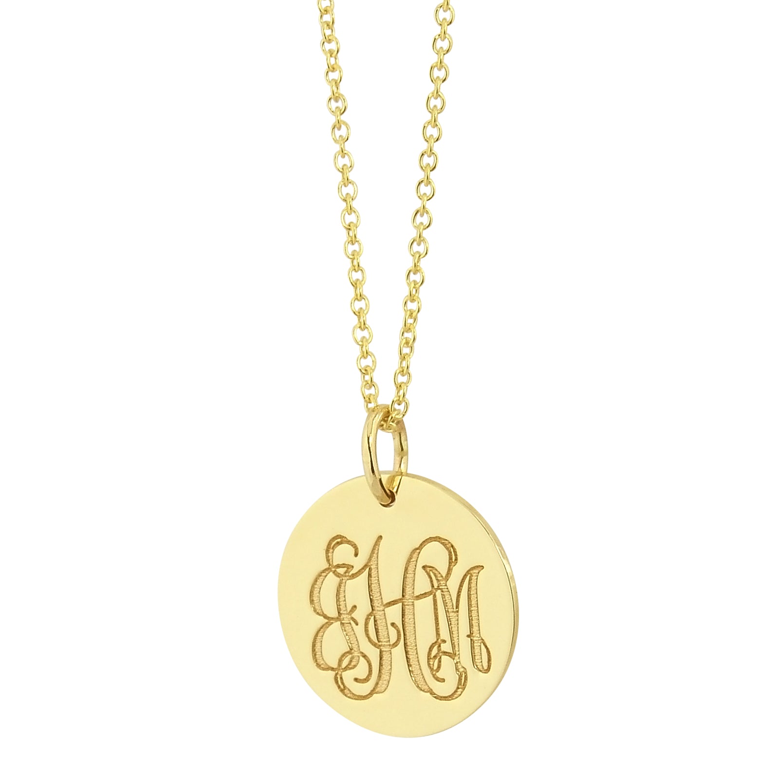 Close-up of laser engraved monogram initials on solid gold round charm