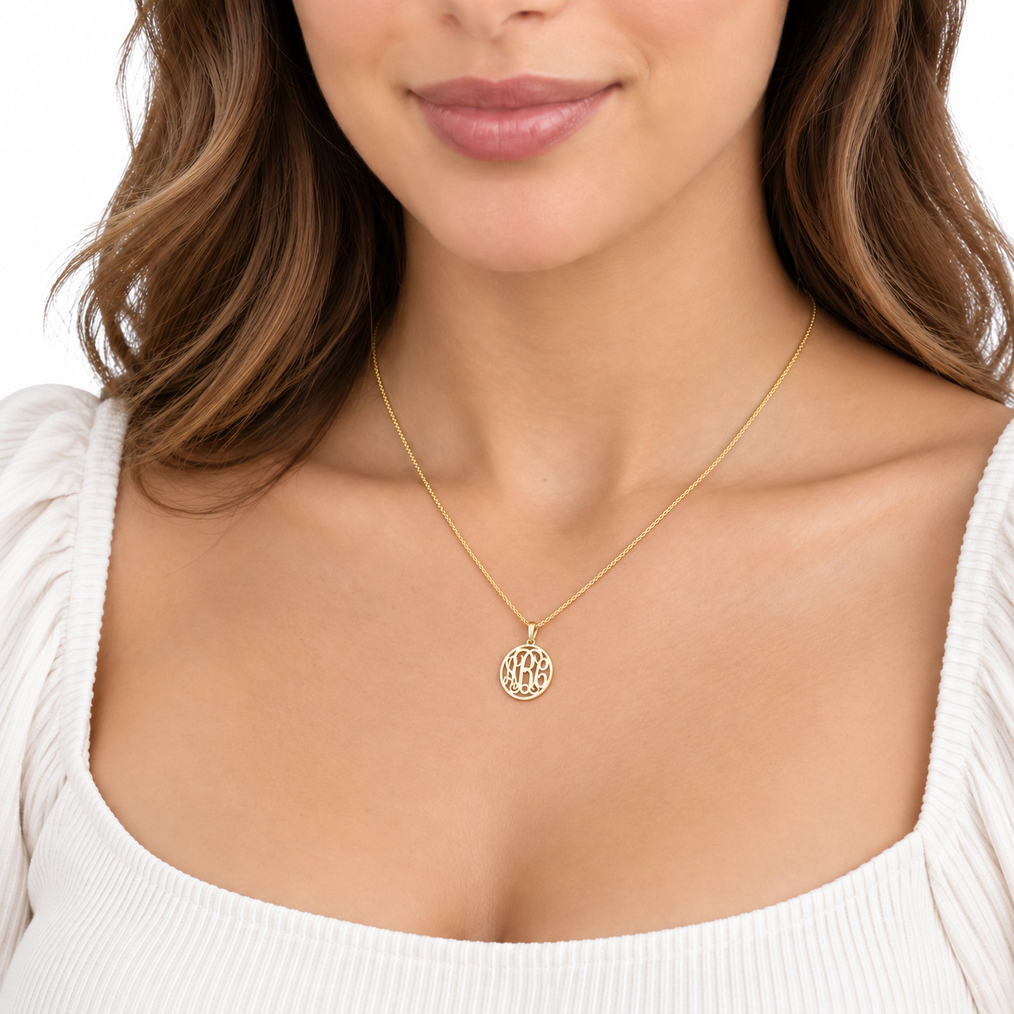 Model wearing a custom extra-small solid gold 3-initial circle monogram pendant necklace.