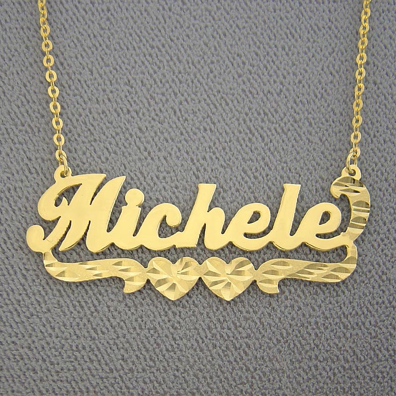 Personalized 14k yellow gold nameplate necklace with hearts and diamond-cut detailing spelling out the name "Michele".