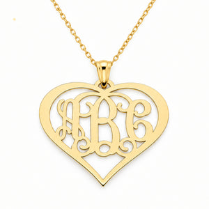 Personalized 10K or 14K solid gold three-initial heart monogram pendant on a white background