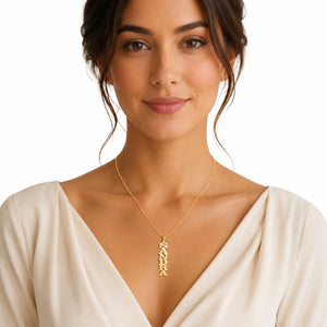 Model showcasing a custom gold vertical block nameplate necklace for an everyday fine jewelry look.