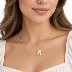Personalized solid gold circle monogram necklace on a woman