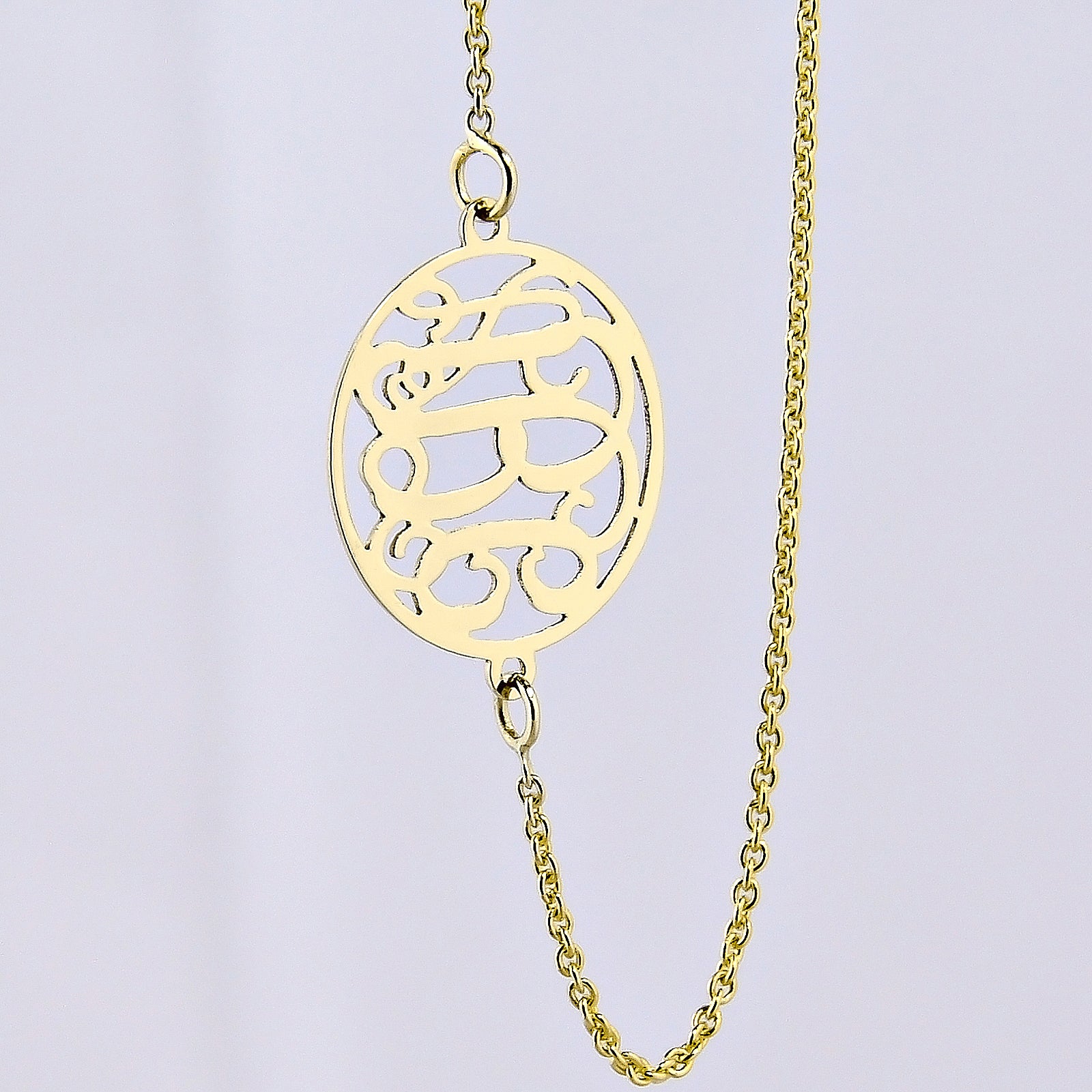 Personalized solid gold circle monogram pendant necklace with a delicate gold chain