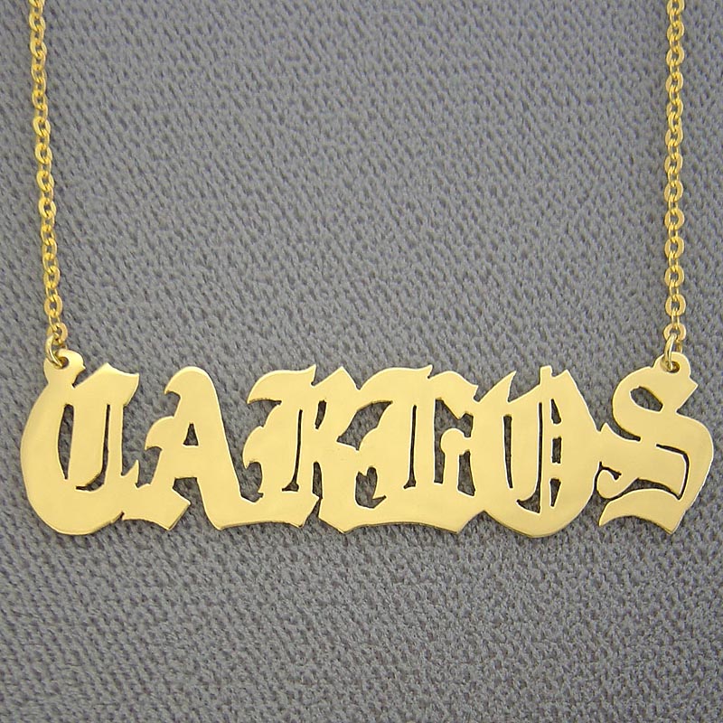 Personalized 14k solid gold Old English font nameplate necklace pendant spelling "Carlos" on a chain.