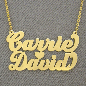 Personalized 10k or 14k solid gold two names heart necklace featuring the names Carrie and David in cursive font with a split chain.