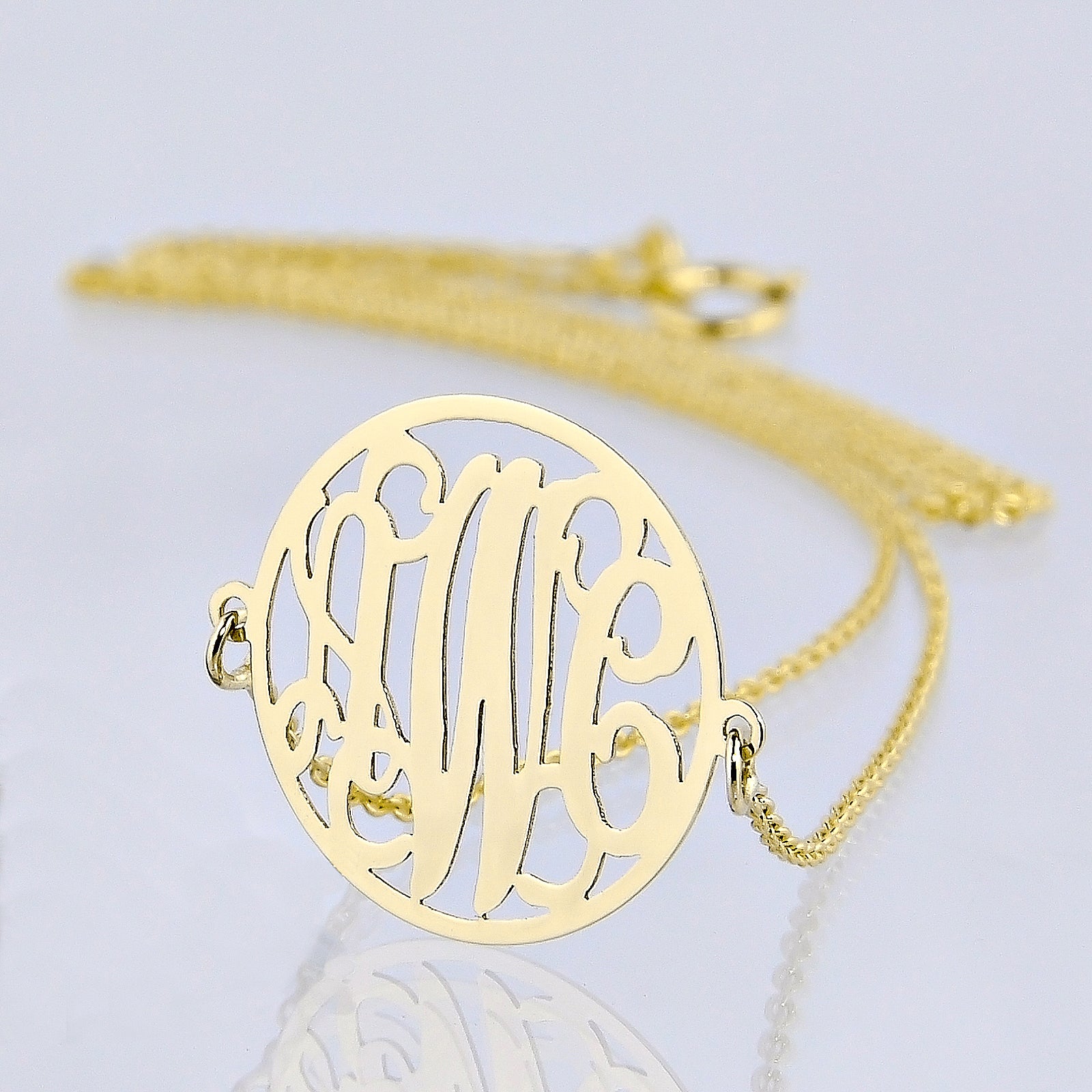 Small solid gold three-initial circle monogram necklace with delicate chain