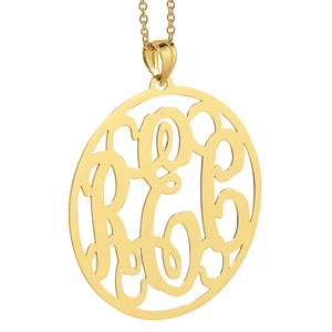 Front view of personalized 1.25 inch solid gold circle monogram pendant featuring intricate 3-letter initial engraving