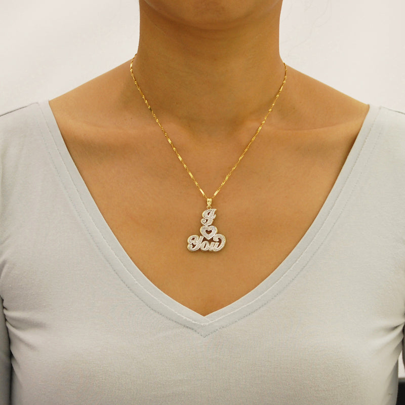 Solid gold two-tone I Love You heart pendant worn on a gold necklace chain