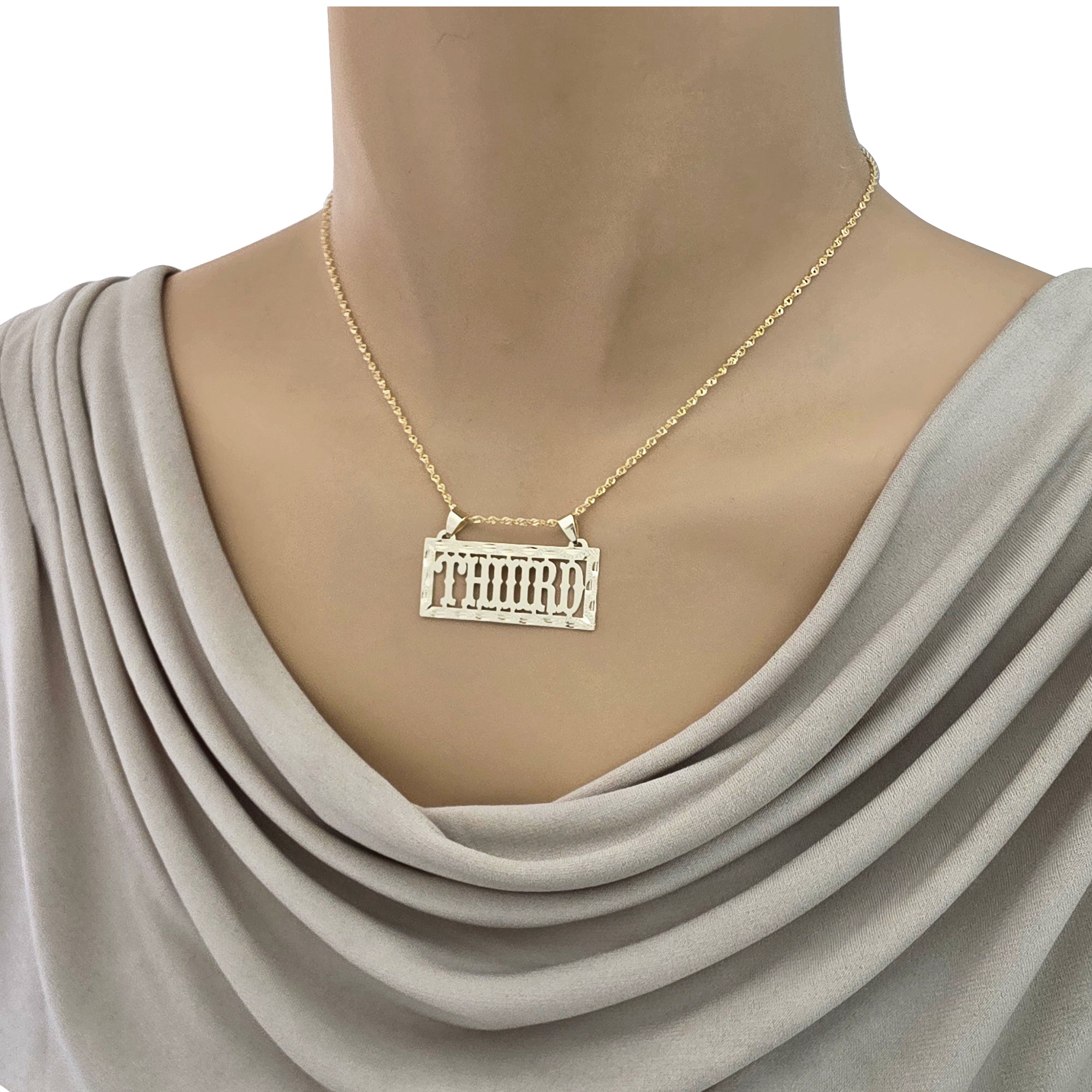 Solid gold personalized rectangular name pendant worn on a mannequin displaying necklace placement and length.